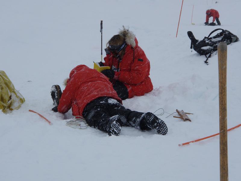 Sarah and Penny measuring ice thickness and snow depth.JPG